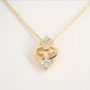 Givenchy VIntage gold-tone necklace with a crystal G logo pendant.